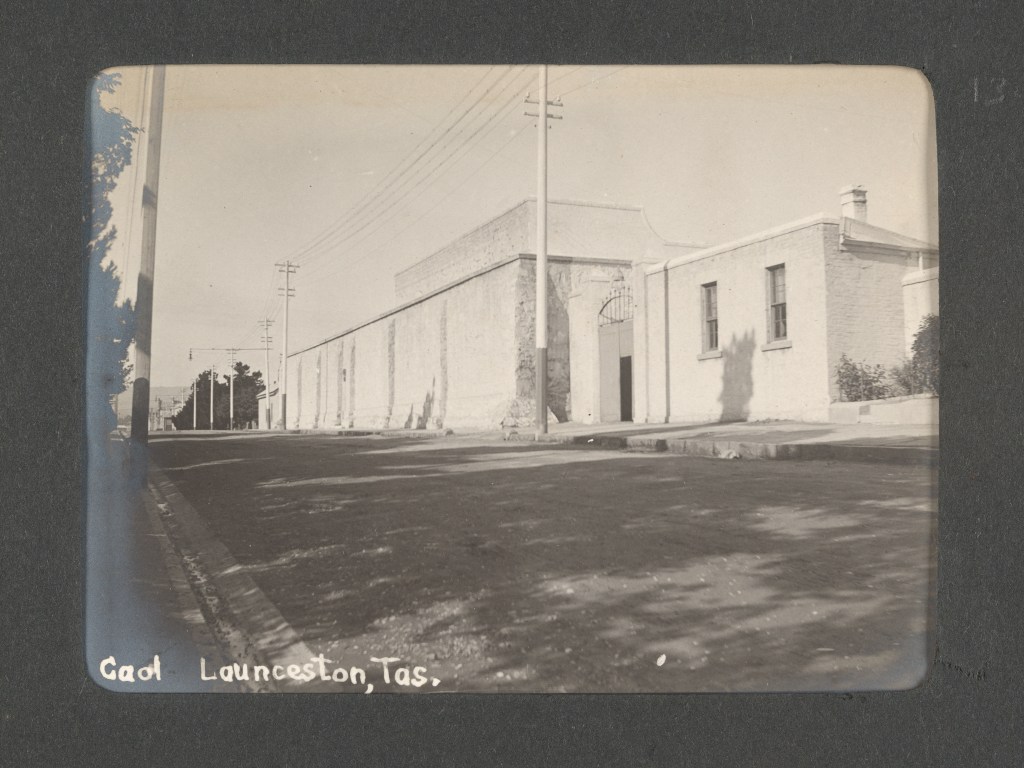 Historic photograph showing the old Launceston Gaol in Paterson Street. Imagen shows a light coloured brick building with high walls.